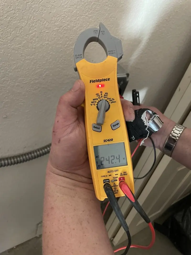 Voltage testing with clamp meter during Circuit Breaker Repair in Troy
